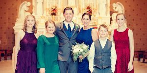 Libby, pictured here with her family, has been a Guest Services volunteer at the Peoria house since January 2020.